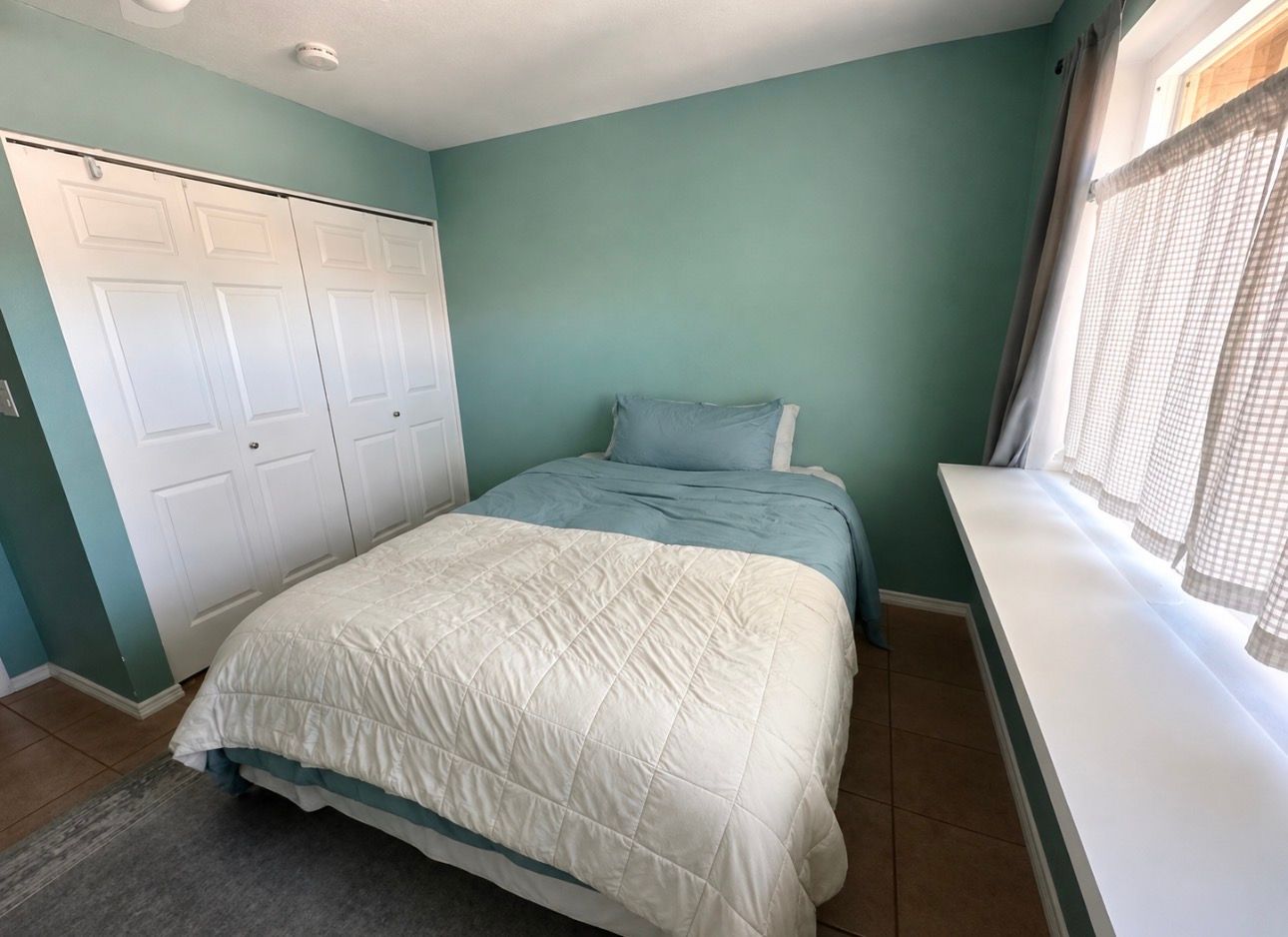 Furnished bedroom in a Single Story Townhome